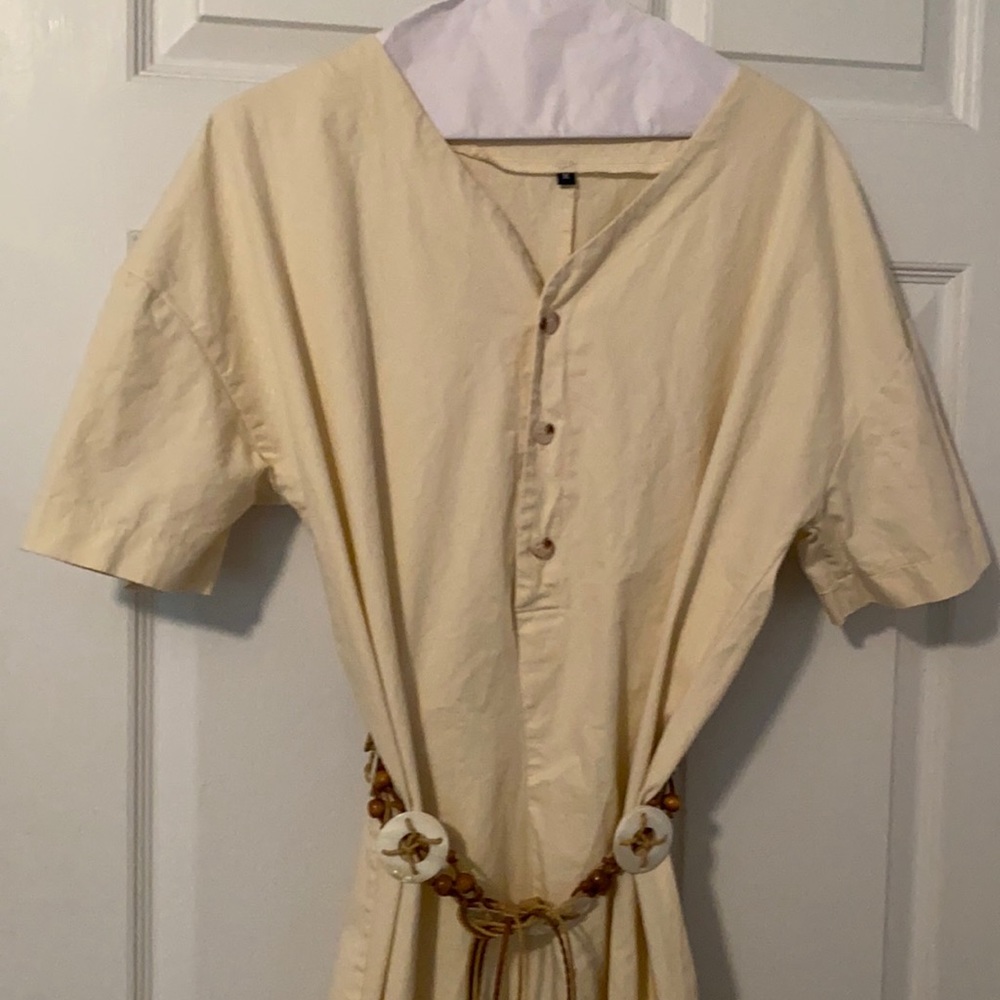 Ecru jumpsuit, never worn. Didn’t fit my daughter.